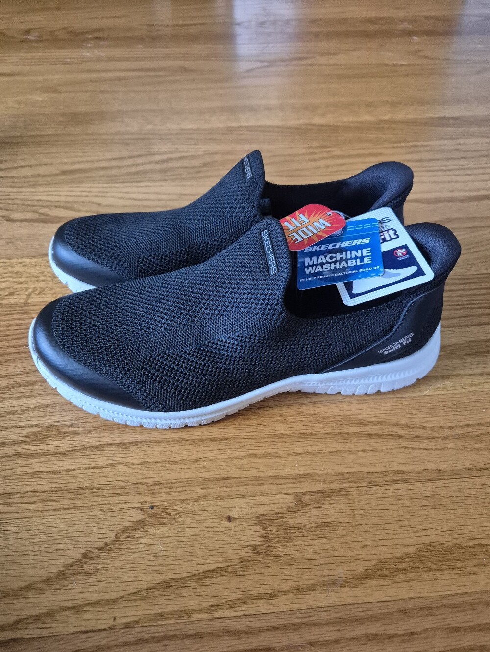 Skechers Women's Black Slip-On Knit Sneakers with White Sole, size 7W NWOB